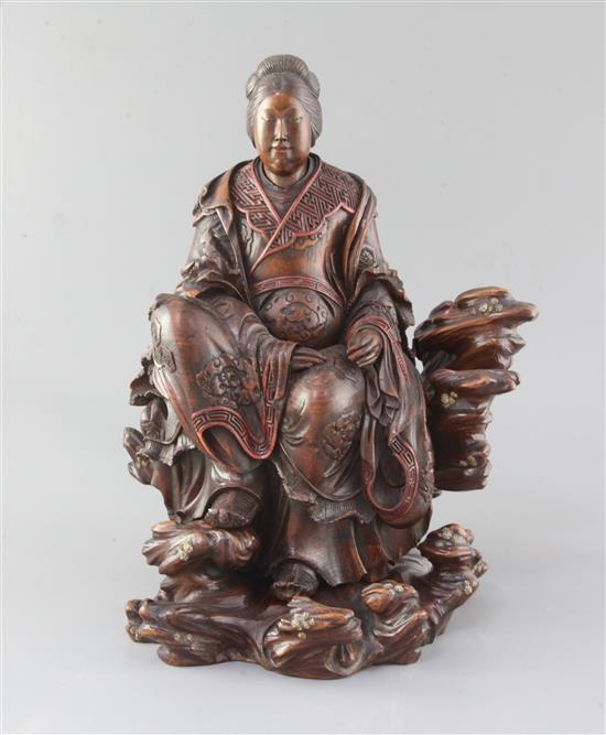 A Japanese wood okimono of the Empress-Consort Jingu seated on a rock, Meiji period, total height 35.5cm